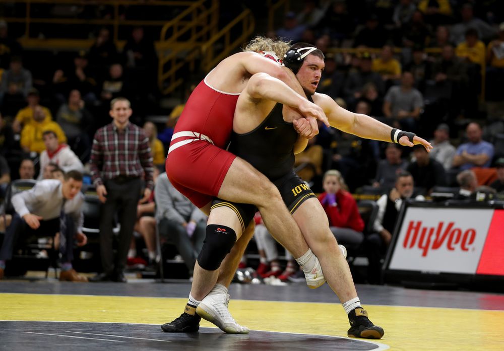IowaÕs Tony Cassioppi wrestles WisconsinÕs Trent Hillger at heavyweight Sunday, December 1, 2019 at Carver-Hawkeye Arena. Cassioppi won the match 3-2. (Brian Ray/hawkeyesports.com)