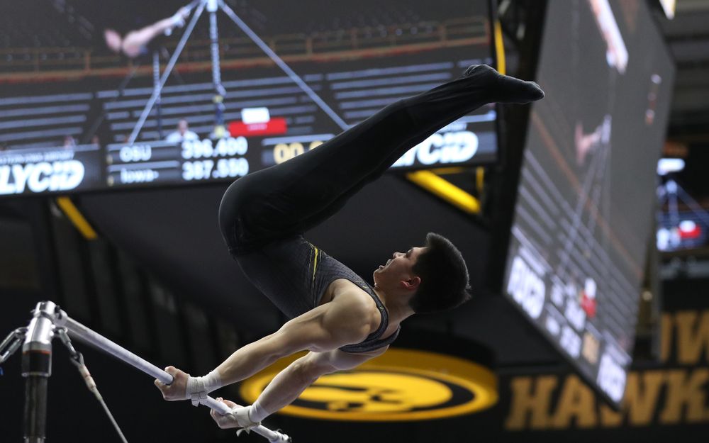 Iowa's Bennet Huang competes on the high bar against the Ohio State Buckeyes Saturday, March 16, 2019 at Carver-Hawkeye Arena. (Brian Ray/hawkeyesports.com)