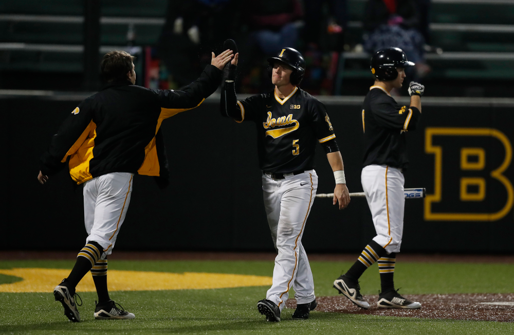 Iowa Hawkeyes catcher Tyler Cropley (5) scores against the Bradley Braves Wednesday, March 28, 2018 at Duane Banks Field. (Brian Ray/hawkeyesports.com)