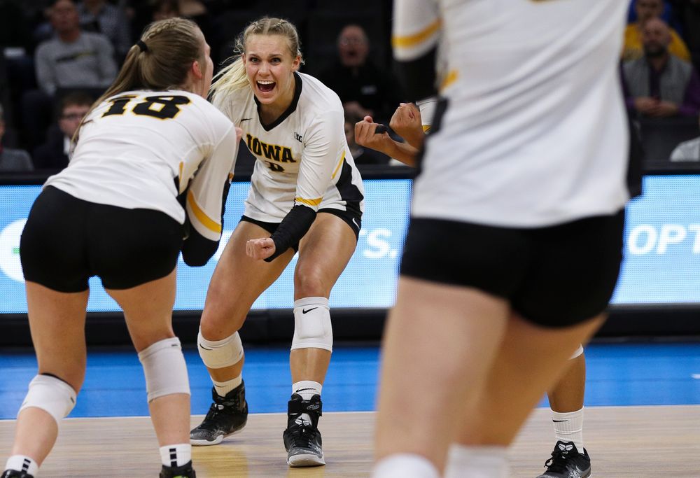 Iowa Hawkeyes right side hitter Reghan Coyle (8) celebrates after winning a point during a match against Nebraska at Carver-Hawkeye Arena on November 7, 2018. (Tork Mason/hawkeyesports.com)
