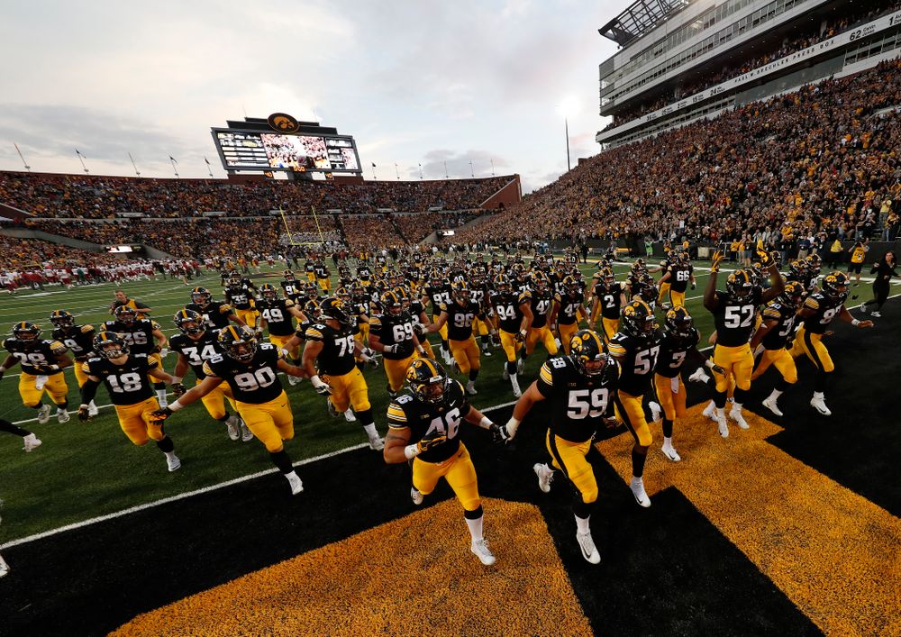 The Iowa Hawkeyes run to get the Cy-Hawk trophy following their game against the Iowa State Cyclones Saturday, September 8, 2018 at Kinnick Stadium. (Brian Ray/hawkeyesports.com)