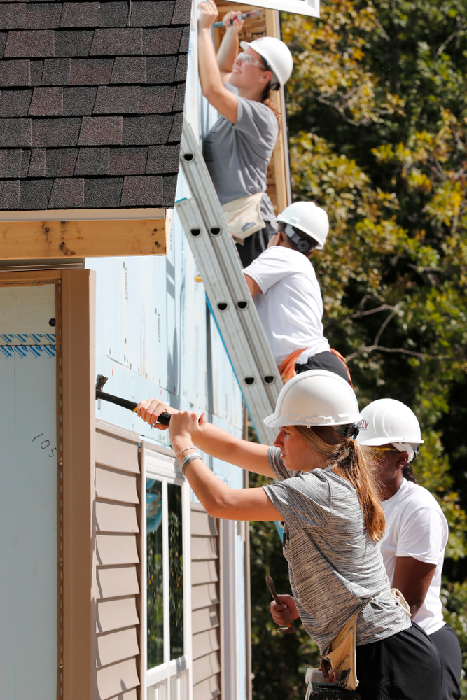 Iowa Hawkeyes forward Logan Cook (23) works on the Habitat for Humanity Women's Build Wednesday, September 26, 2018 in Iowa City. (Brian Ray/hawkeyesports.com)