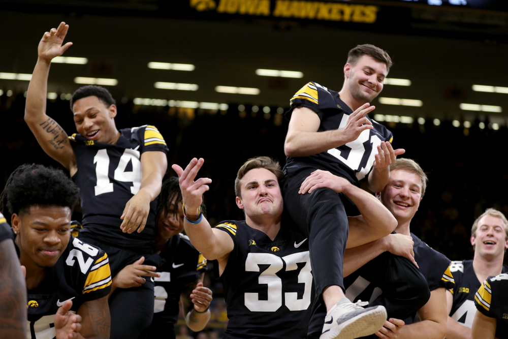 Members of the Hawkeye Football team performs with the Iowa Dance Team at halftime of the Iowa Hawkeyes game against the Ohio State Buckeyes Thursday, February 20, 2020 at Carver-Hawkeye Arena. (Brian Ray/hawkeyesports.com)