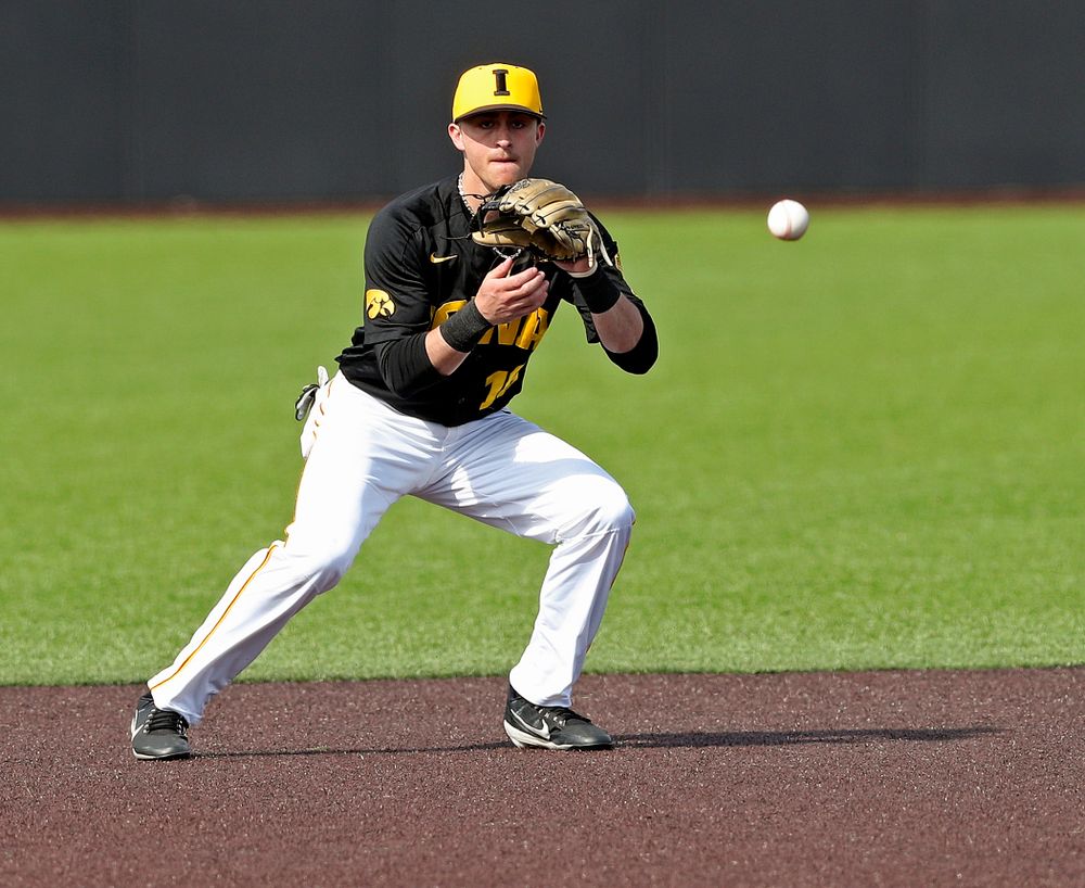 Iowa Hawkeyes shortstop Tanner Wetrich (16) fields a ground ball during the sixth inning of their game against Rutgers at Duane Banks Field in Iowa City on Saturday, Apr. 6, 2019. (Stephen Mally/hawkeyesports.com)