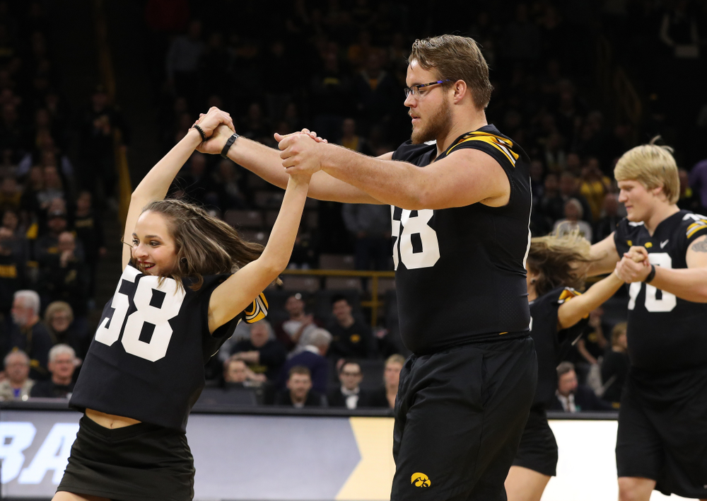 The Iowa Dance Team performs with the Iowa Football Team at halftime of the Iowa Hawkeyes game against the Indiana Hoosiers Friday, February 22, 2019 at Carver-Hawkeye Arena. (Brian Ray/hawkeyesports.com)