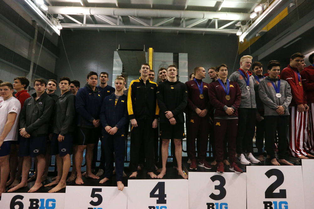 Iowa's Joe Myhre, Jack Smith, Will Scott, and Steve Fiolic after the 200-yard freestyle relay race Friday, March 1, 2019 at the Campus Recreation and Wellness Center. (Lily Smith/hawkeyesports.com)