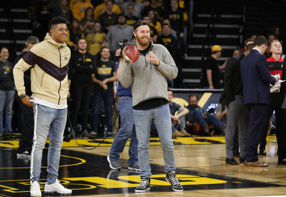 Former Hawkeye Football players and current San Francisco 49ers Greg Mabin, and CJ Beathard, against the Ohio State Buckeyes Saturday, January 12, 2019 at Carver-Hawkeye Arena. (Brian Ray/hawkeyesports.com)