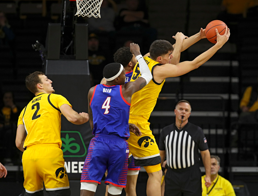 Iowa Hawkeyes center Luka Garza (55) pulls down a rebound during the first half of their game at Carver-Hawkeye Arena in Iowa City on Monday, Nov 11, 2019. (Stephen Mally/hawkeyesports.com)
