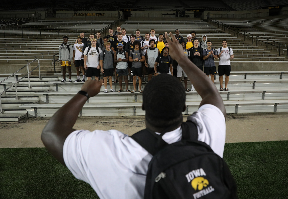 Iowa Hawkeyes defensive tackle Daviyon Nixon (54) leads the new players in the ÒFight SongÓ Thursday, August 22, 2019 at Kinnick Stadium in Iowa City. (Brian Ray/hawkeyesports.com)