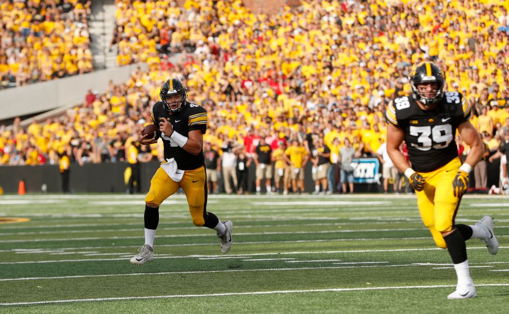 Iowa Hawkeyes quarterback Nate Stanley (4) carries the ball against the Northern Illinois Huskies Saturday, September 1, 2018 at Kinnick Stadium. (Brian Ray/hawkeyesports.com)