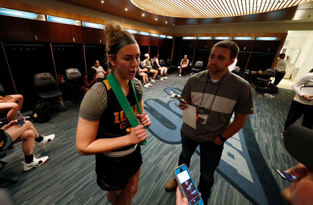 Iowa Hawkeyes forward Hannah Stewart (21) answers questions before practice Friday, March 16, 2018 at Pauley Pavilion on the campus of UCLA. (Brian Ray/hawkeyesports.com)