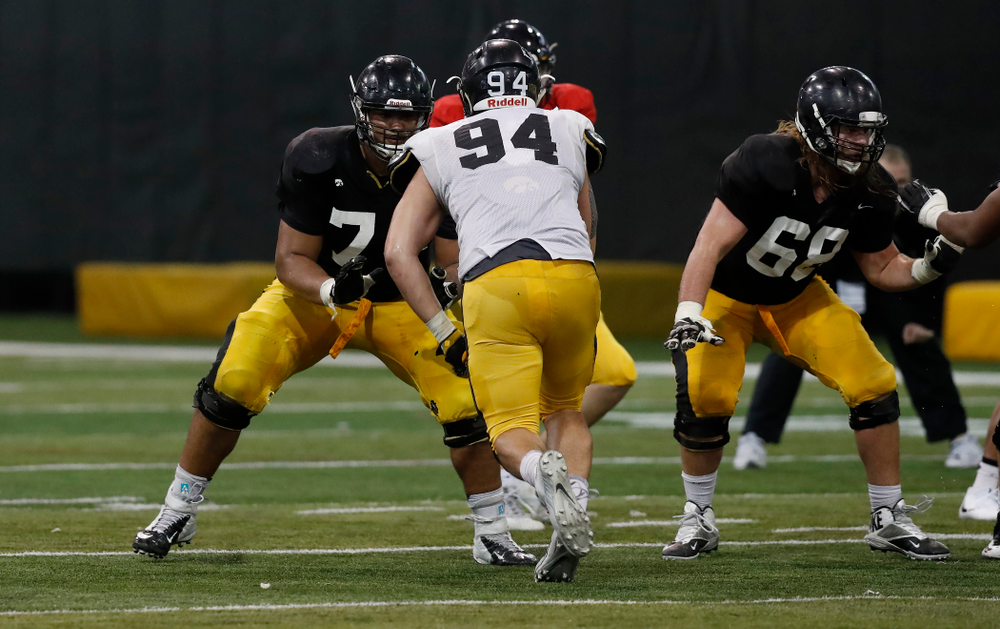 Iowa Hawkeyes offensive lineman Tristan Wirfs (74), offensive lineman Landan Paulsen (68), and defensive end A.J. Epenesa (94) during spring practice No. 13 Wednesday, April 18, 2018 at the Hansen Football Performance Center. (Brian Ray/hawkeyesports.com)