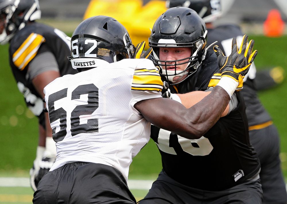 Iowa Hawkeyes linebacker Amani Jones (52) tries to get around offensive lineman Ezra Miller (76) during Fall Camp Practice No. 15 at the Hansen Football Performance Center in Iowa City on Monday, Aug 19, 2019. (Stephen Mally/hawkeyesports.com)