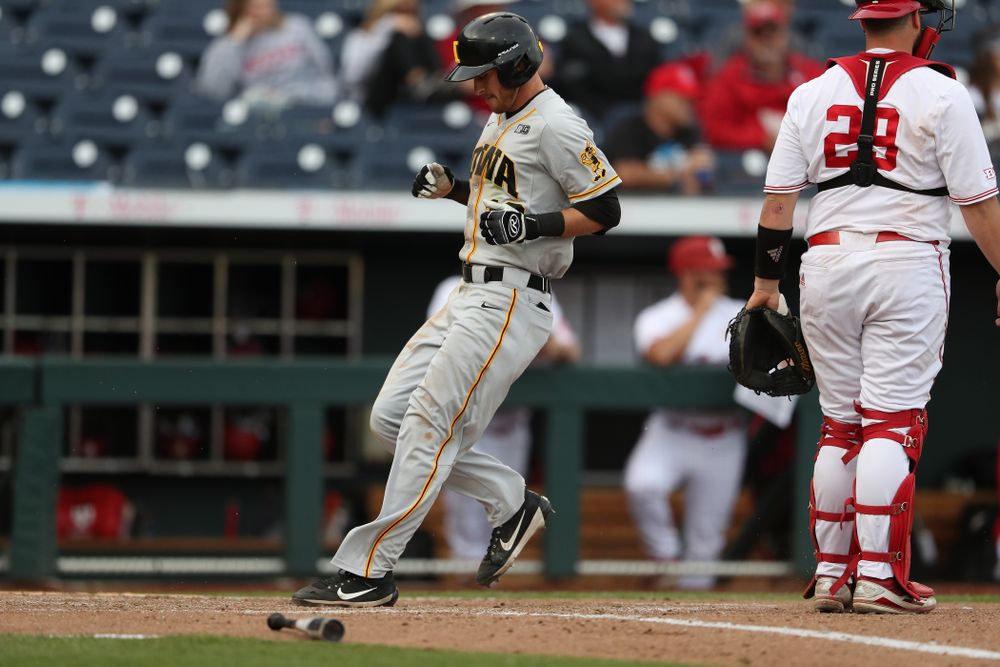 Iowa Hawkeyes Tanner Wetrich (16) scores against the Indiana Hoosiers in the first round of the Big Ten Baseball Tournament Wednesday, May 22, 2019 at TD Ameritrade Park in Omaha, Neb. (Brian Ray/hawkeyesports.com)
