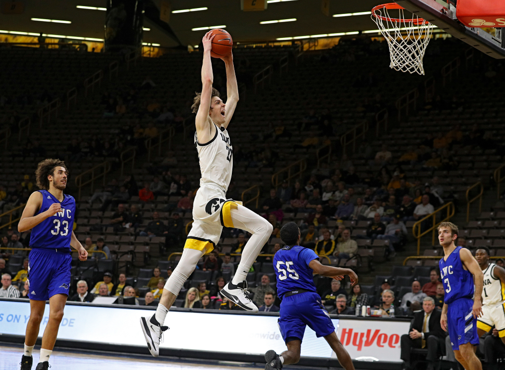 Iowa Hawkeyes forward Patrick McCaffery (22) dunks the ball during the second half of their exhibition game against Lindsey Wilson College at Carver-Hawkeye Arena in Iowa City on Monday, Nov 4, 2019. (Stephen Mally/hawkeyesports.com)