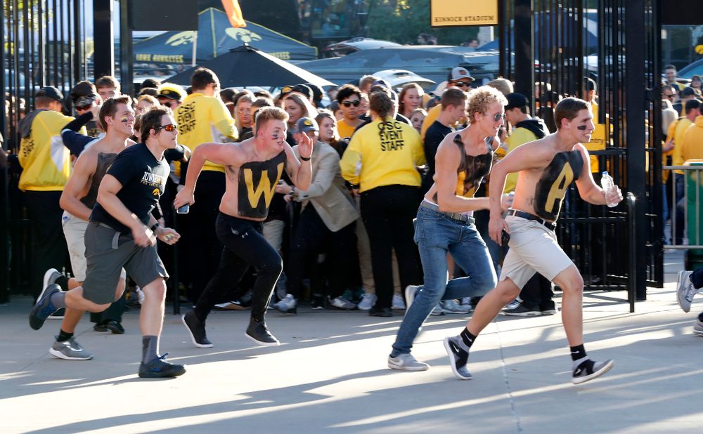 Students run to get seats before the Iowa Hawkeyes game against the Wisconsin Badgers Saturday, September 22, 2018 at Kinnick Stadium. (Brian Ray/hawkeyesports.com)