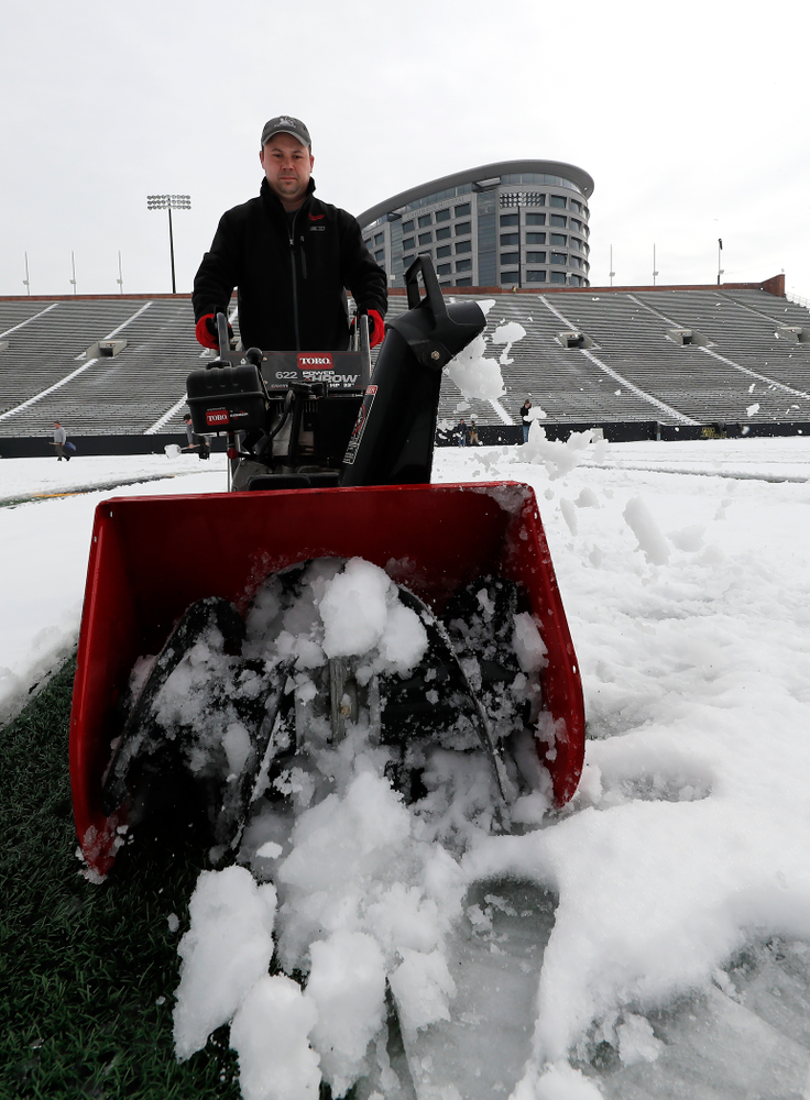 Members of the Iowa Athletics Turf Management staff create the #SnowWave for kids in the Stead Family Children's Hospital Thursday, February