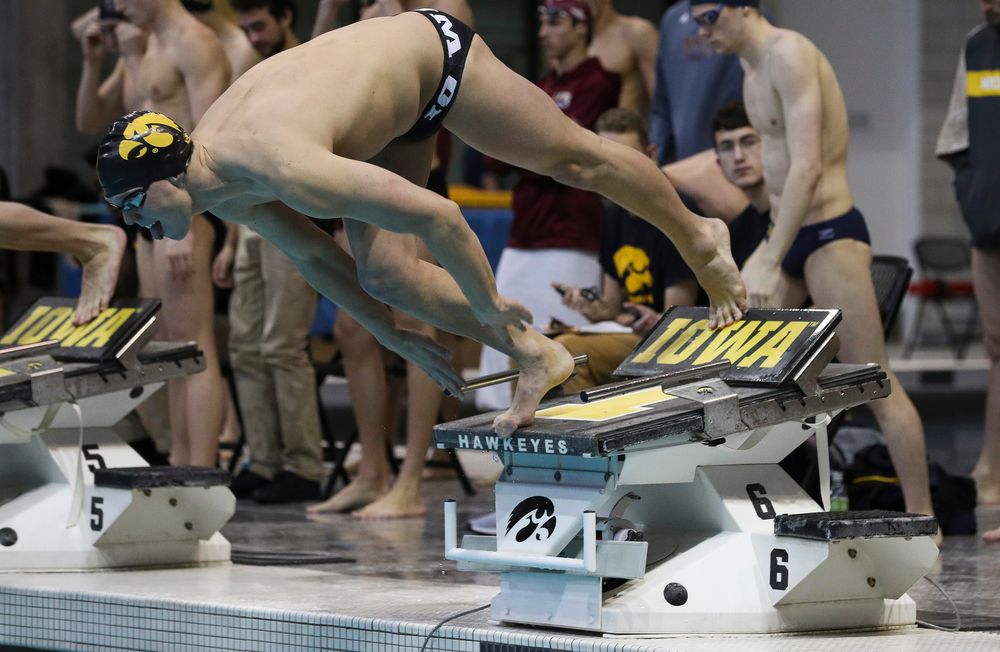 Iowa's Forrest White competes in the 200-yard freestyle relay during a meet against Michigan and Denver at the Campus Recreation and Wellness Center on November 3, 2018. (Tork Mason/hawkeyesports.com)
