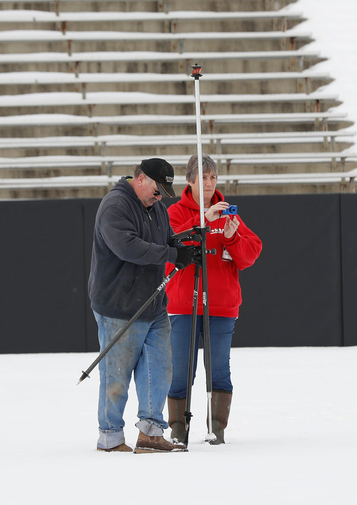 Members of the Iowa Athletics Turf Management staff create the #SnowWave for kids in the Stead Family Children's Hospital Thursday, February