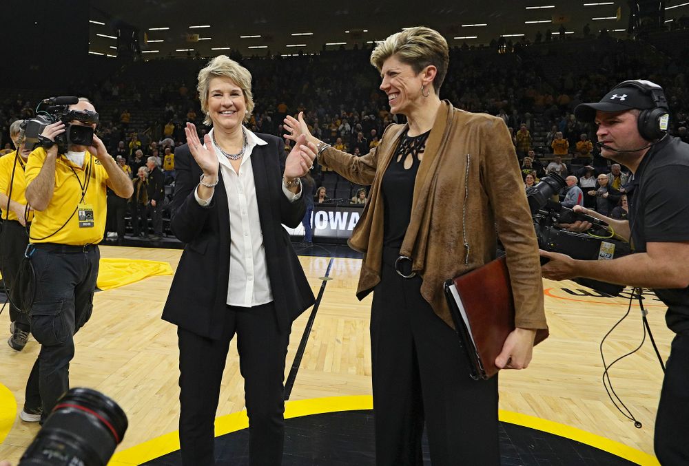 Iowa Hawkeyes head coach Lisa Bluder and associate head coach Jan Jensen after winning their game at Carver-Hawkeye Arena in Iowa City on Thursday, January 23, 2020. (Stephen Mally/hawkeyesports.com)