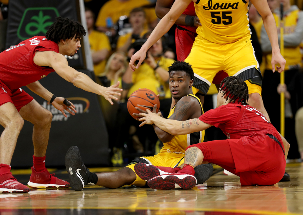 Iowa Hawkeyes guard Joe Toussaint (1) collects a loose ball against the Rutgers Scarlet Knights Wednesday, January 22, 2020 at Carver-Hawkeye Arena. (Brian Ray/hawkeyesports.com)