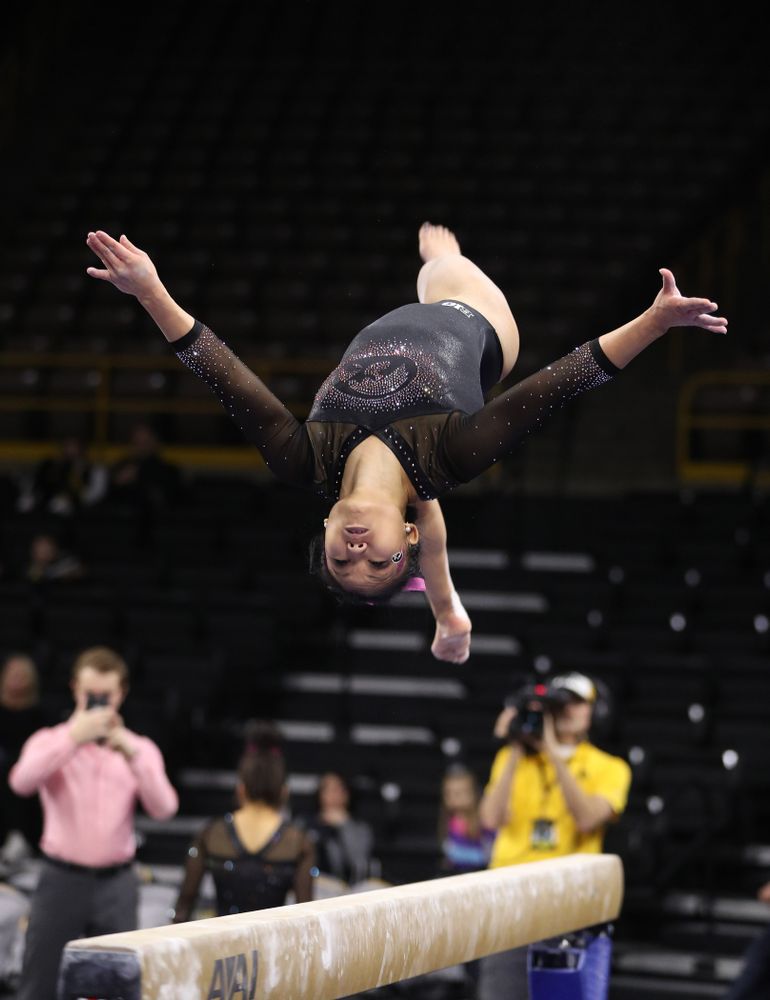 Iowa's Lauren Guerin competes on the bars during their meet against the Minnesota Golden Gophers Saturday, January 19, 2019 at Carver-Hawkeye Arena. (Brian Ray/hawkeyesports.com)