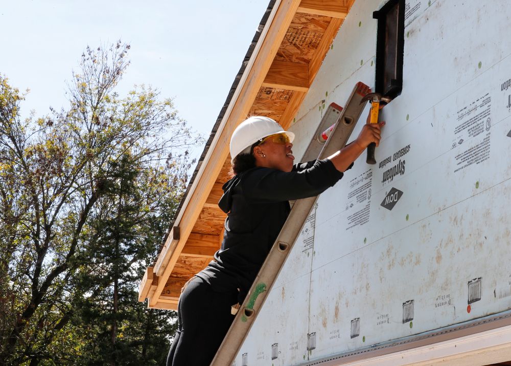 Iowa Hawkeyes guard Alexis Sevillian (5) works on the Habitat for Humanity Women's Build Wednesday, September 26, 2018 in Iowa City. (Brian Ray/hawkeyesports.com)