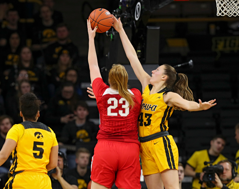 Iowa Hawkeyes forward Amanda Ollinger (43) blocks a shot by Ohio State Buckeyes forward Rebeka Mikulasikova (23) during the third quarter of their game at Carver-Hawkeye Arena in Iowa City on Thursday, January 23, 2020. (Stephen Mally/hawkeyesports.com)