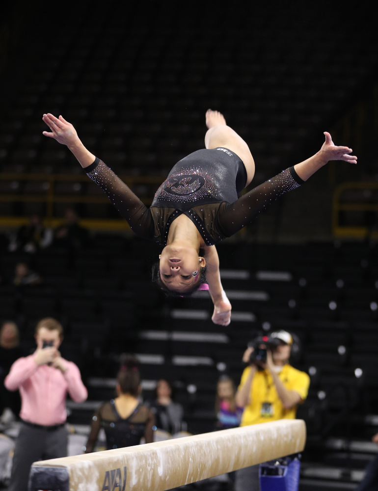 Iowa's Lauren Guerin competes on the bars during their meet against the Minnesota Golden Gophers Saturday, January 19, 2019 at Carver-Hawkeye Arena. (Brian Ray/hawkeyesports.com)