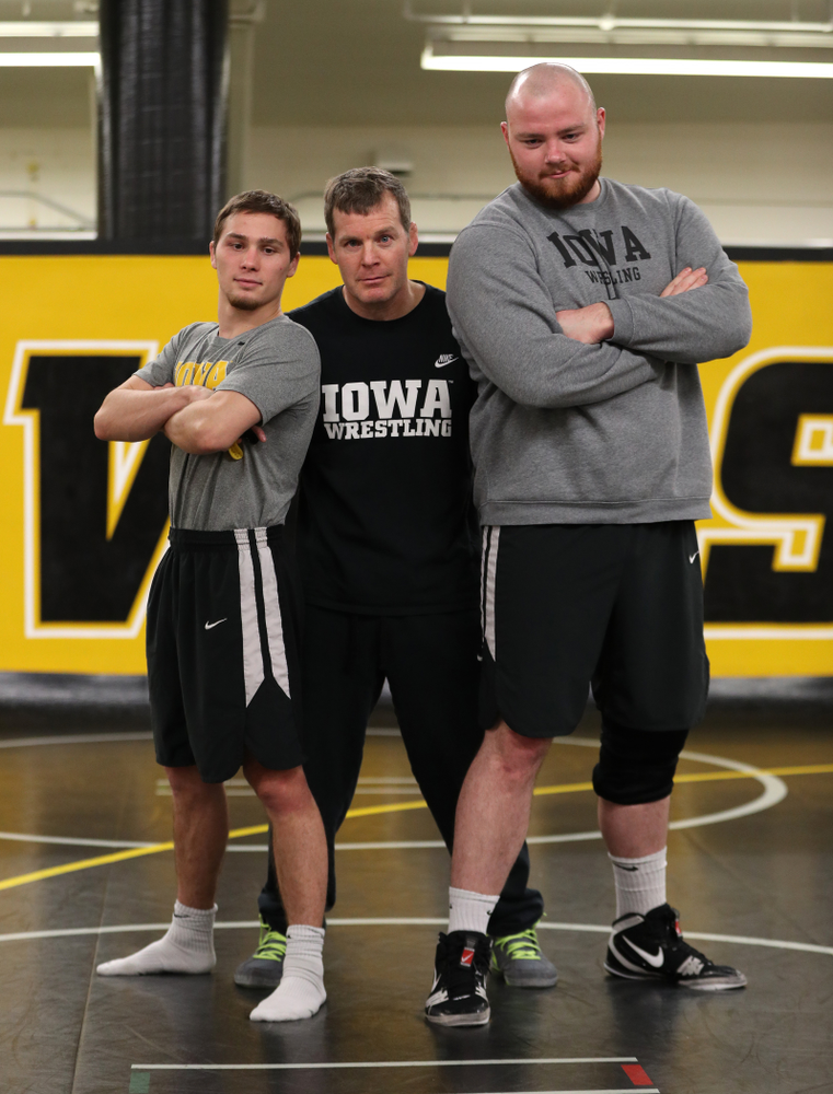 Iowa Hawkeyes head coach Tom Brands photobombs Spencer Lee and Sam Stoll during the team's annual media day Monday, November 5, 2018 at Carver-Hawkeye Arena. (Brian Ray/hawkeyesports.com)