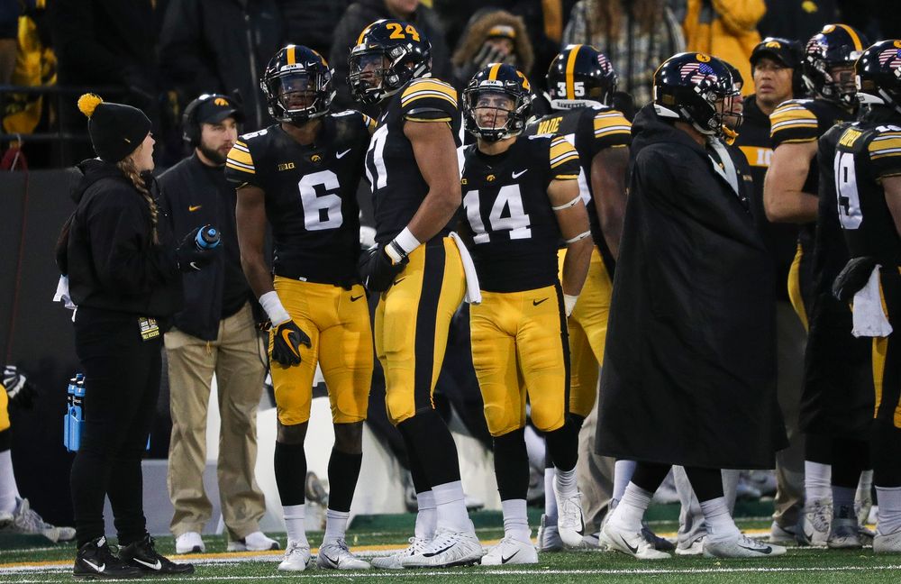 Iowa Hawkeyes wide receiver Ihmir Smith-Marsette (6) watches the video board as officials review his catch, which was originally ruled incomplete, during a game against Northwestern at Kinnick Stadium on November 10, 2018. (Tork Mason/hawkeyesports.com)