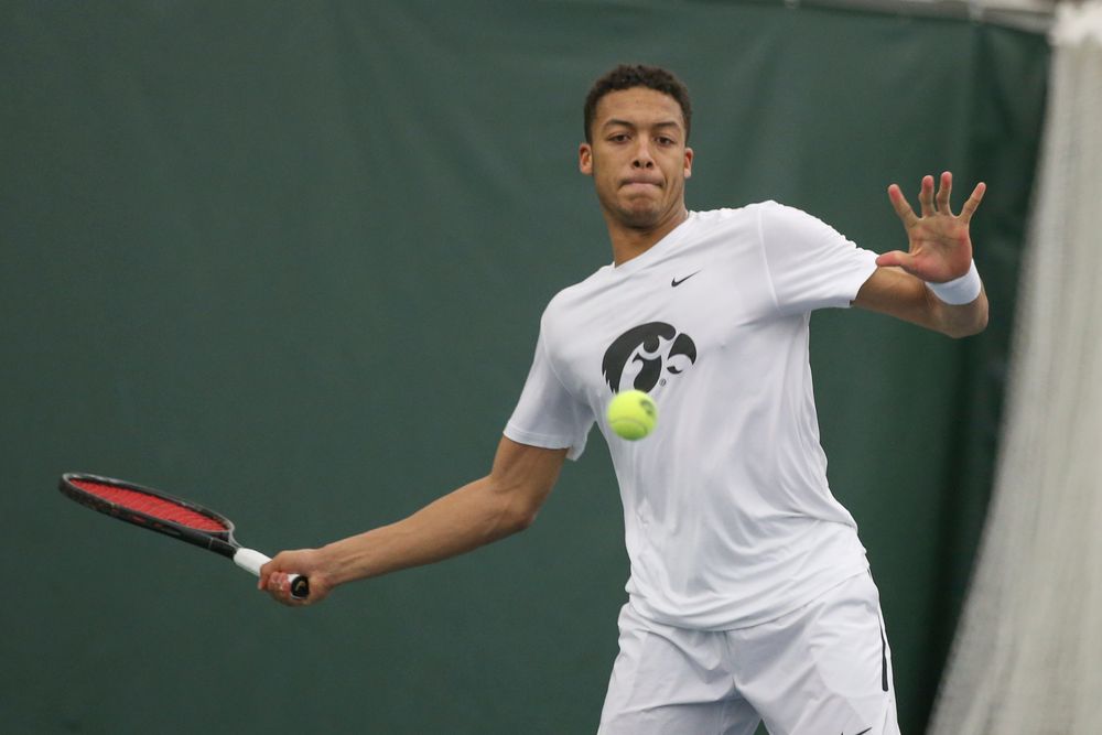 Iowa’s Oliver Okonkwo returns a hit during the Iowa men’s tennis meet vs Nebraska on Sunday, March 1, 2020 at the Hawkeye Tennis and Recreation Complex. (Lily Smith/hawkeyesports.com)