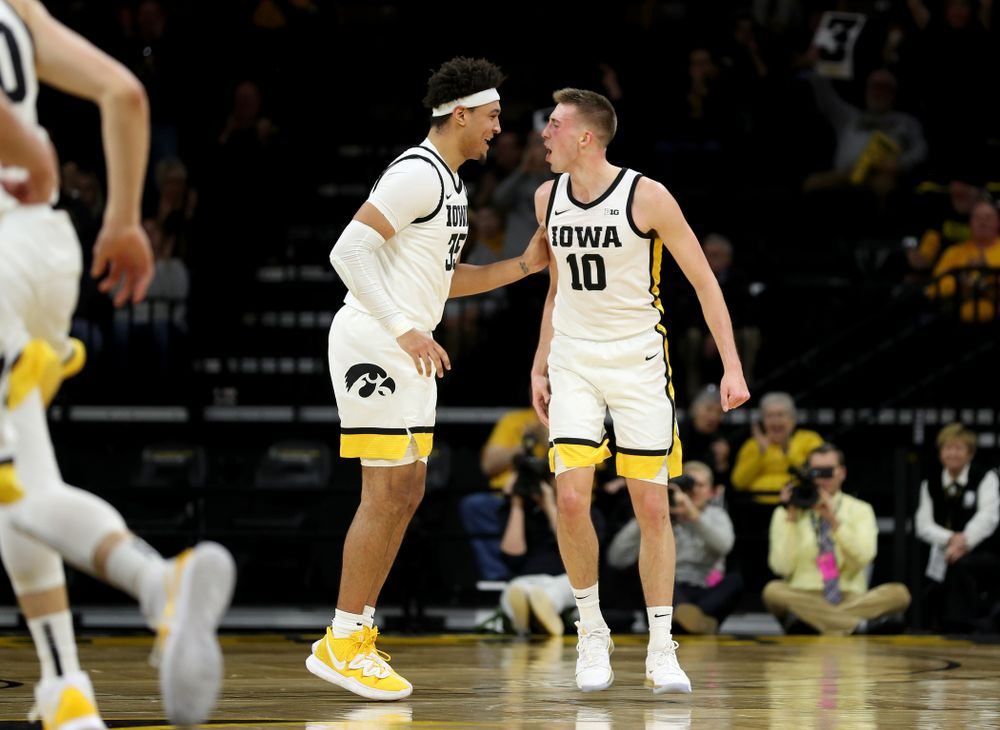 Iowa Hawkeyes guard Joe Wieskamp (10) celebrates a three point basket with forward Cordell Pemsl (35) against the Maryland Terrapins Friday, January 10, 2020 at Carver-Hawkeye Arena. (Brian Ray/hawkeyesports.com)