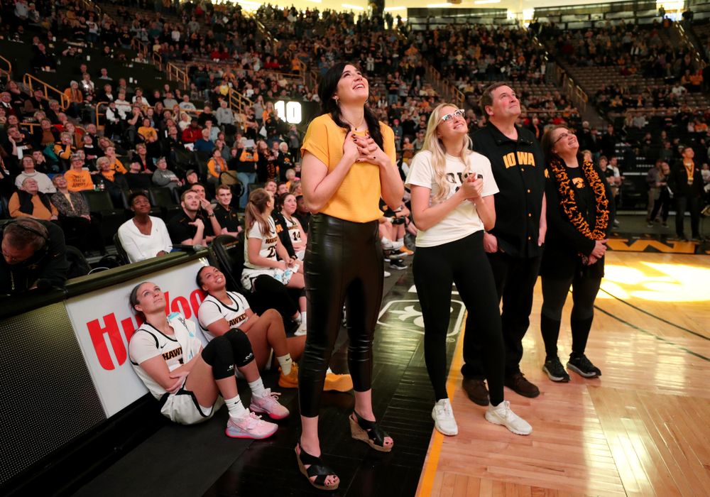 Megan Gustafson watches a video message from her teammates and coaches after her number was raised into the rafters during a jersey retirement ceremony Sunday, January 26, 2020 at Carver-Hawkeye Arena. (Brian Ray/hawkeyesports.com)