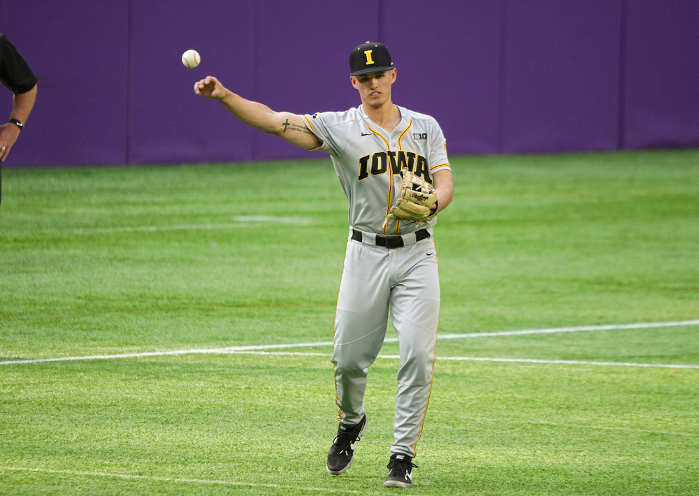 Iowa Hawkeyes infielder Dylan Nedved (17) throw the ball back to the pitcher during the seventh inning of their CambriaCollegeClassic game at U.S. Bank Stadium in Minneapolis, Minn. on Friday, February 28, 2020. (Stephen Mally/hawkeyesports.com)