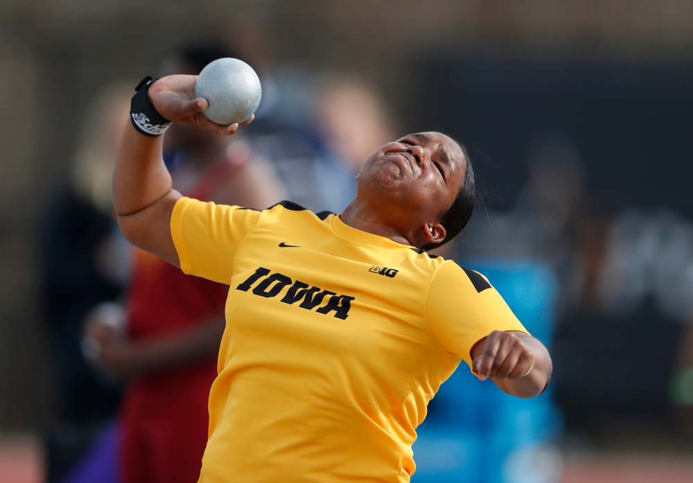 Iowa's Iowa's Nia Britt competes in the shot put during the 2018 MUSCO Twilight Invitational Thursday, April 12, 2018 at the Cretzmeyer Tra