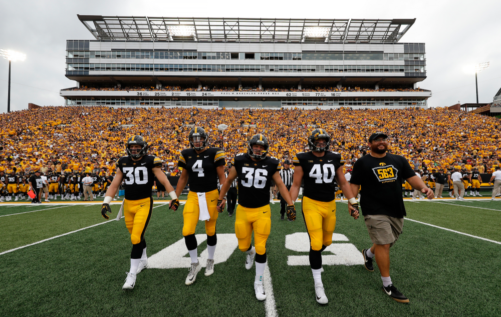 Captains Jake Gervase, Nate Stanley, Brady Ross, Parker Hesse, and Honorary Captain Julian Vandervelde against the Norther Illinois Huskies Saturday, September 1, 2018 . (Brian Ray/hawkeyesports.com)