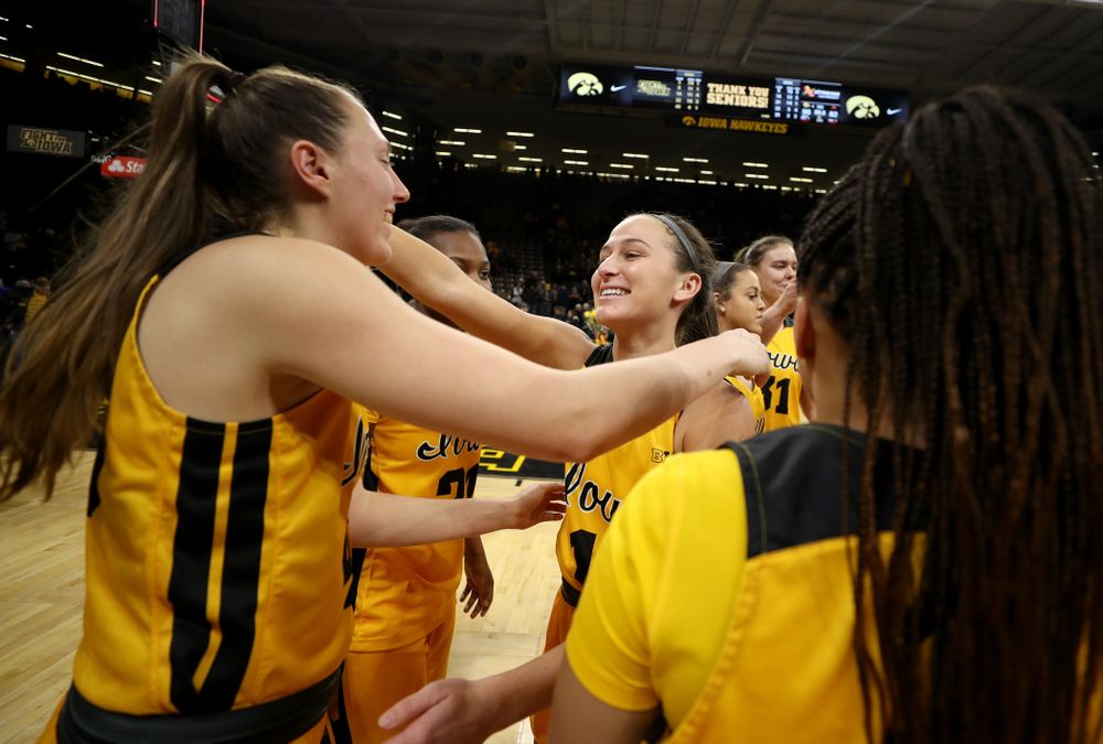 Iowa Hawkeyes forward Amanda Ollinger (43) hugs guard Megan Meyer (11) during senior day activities following their win over the Minnesota Golden Gophers Thursday, February 27, 2020 at Carver-Hawkeye Arena. (Brian Ray/hawkeyesports.com)