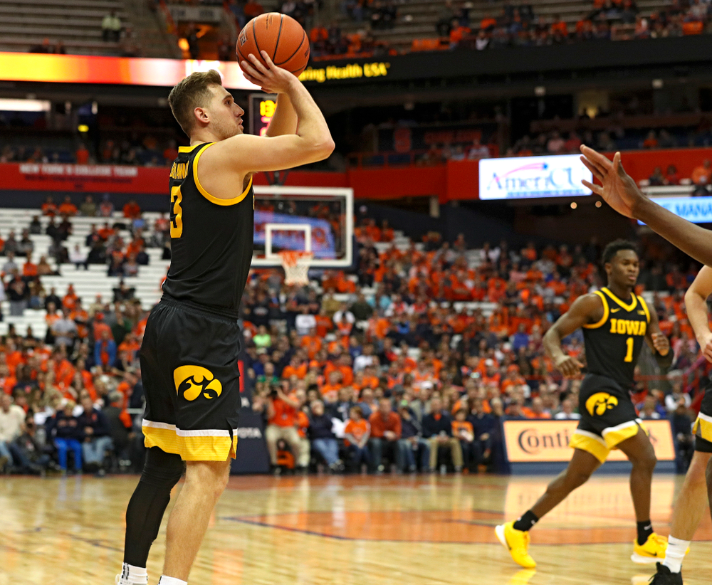 Iowa Hawkeyes guard Jordan Bohannon (3) makes a 3-pointer during the second half of their ACC/Big Ten Challenge game at the Carrier Dome in Syracuse, N.Y. on Tuesday, Dec 3, 2019. (Stephen Mally/hawkeyesports.com)