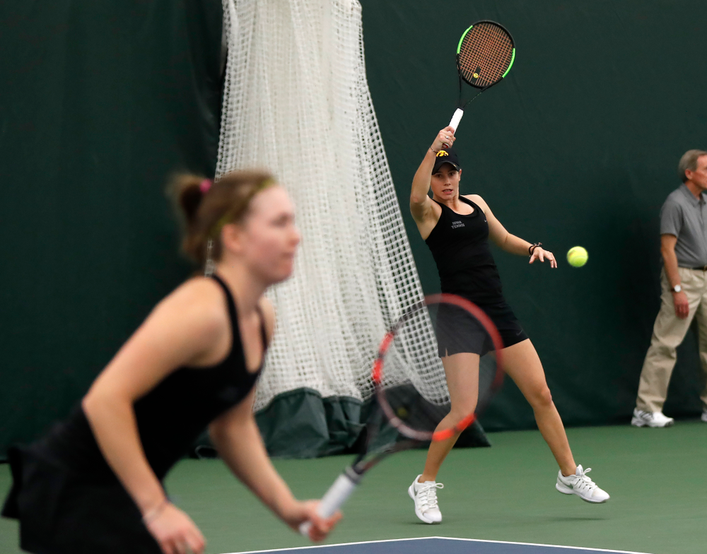 Elise Van Heuvelen and Anastasia Reimchen play a doubles match against Ohio State Sunday, March 25, 2018 at the Hawkeye Tennis and Recreation Center. (Brian Ray/hawkeyesports.com)