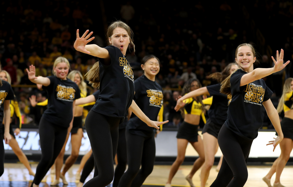 The Iowa Spirit Squad performs with participants in Spirit Squad Day at halftime of the Iowa Hawkeyes game against the Nebraska Cornhuskers Saturday, February 8, 2020 at Carver-Hawkeye Arena. (Brian Ray/hawkeyesports.com)