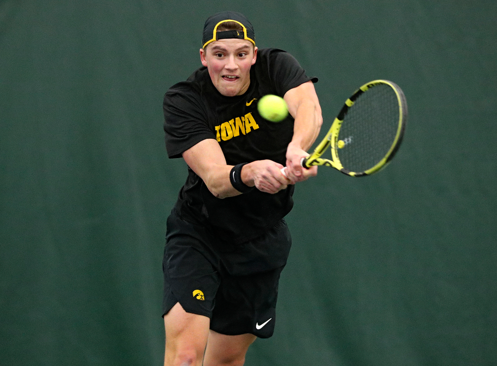 Iowa’s Joe Tyler returns a shot during his doubles match at the Hawkeye Tennis and Recreation Complex in Iowa City on Friday, February 14, 2020. (Stephen Mally/hawkeyesports.com)