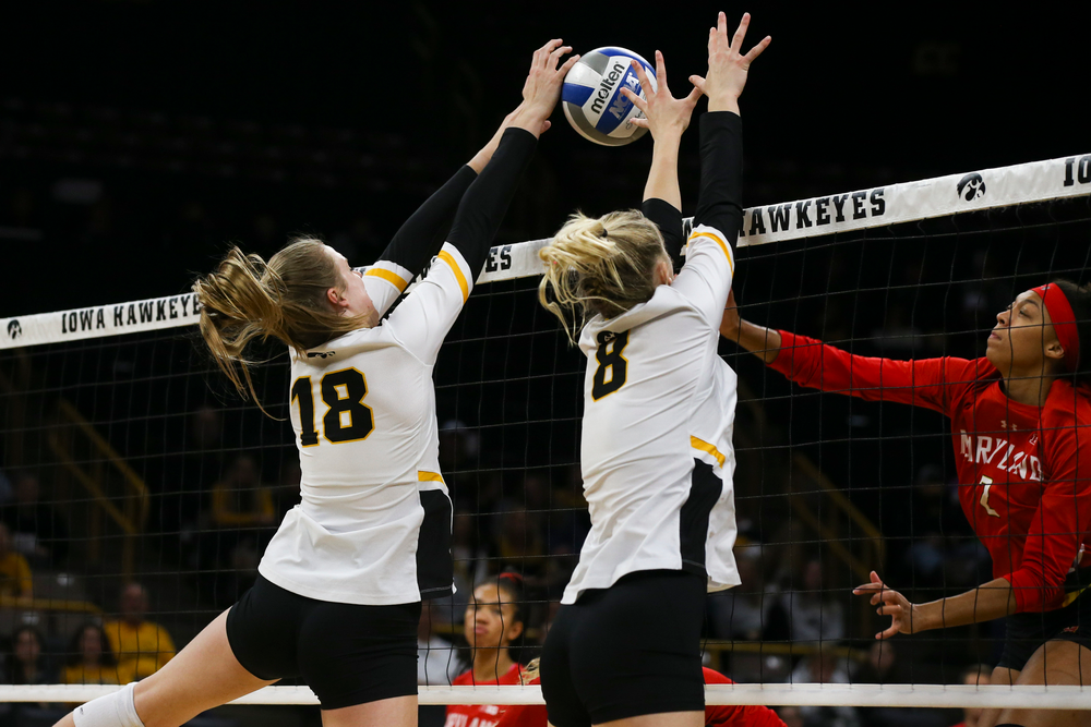 Iowa Hawkeyes middle blocker Hannah Clayton (18) and Iowa Hawkeyes outside hitter Kyndra Hansen (8) during Iowa volleyball vs Maryland on Saturday, November 30, 2019 at Carver-Hawkeye Arena. (Lily Smith/hawkeyesports.com)