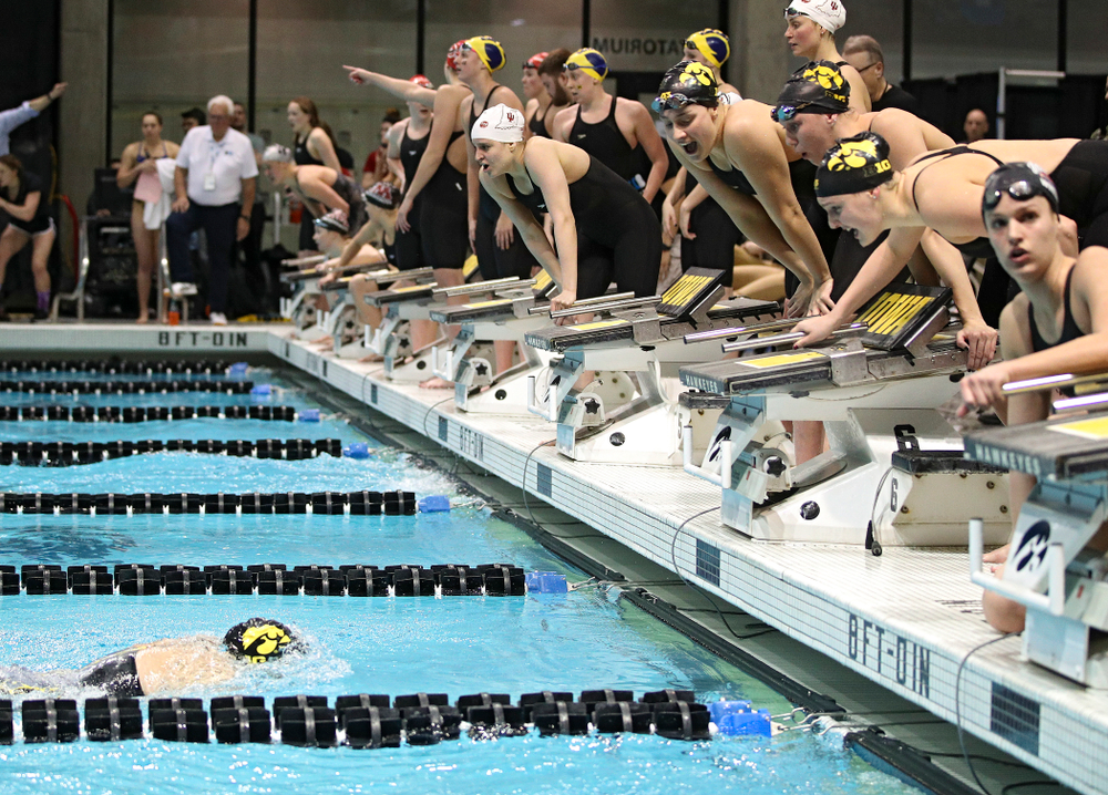 Iowa’s Macy Rink is urged on by teammates Hannah Burvill, Allyssa Fluit, and Emilia Sansome as she swims the 800 yard freestyle relay event during the 2020 Big Ten Women’s Swimming and Diving Championships at the Campus Recreation and Wellness Center in Iowa City on Wednesday, February 19, 2020. (Stephen Mally/hawkeyesports.com)