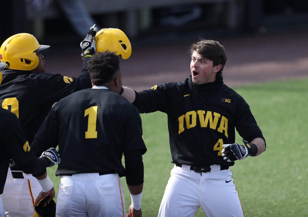 Iowa Hawkeyes infielder Mitchell Boe (4) reacts after hitting a game tying three-run homer against California State Northridge Sunday, March 17, 2019 at Duane Banks Field. (Brian Ray/hawkeyesports.com)