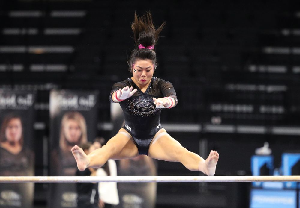 Iowa's Clair Kaji competes on the bars during their meet against the Minnesota Golden Gophers Saturday, January 19, 2019 at Carver-Hawkeye Arena. (Brian Ray/hawkeyesports.com)
