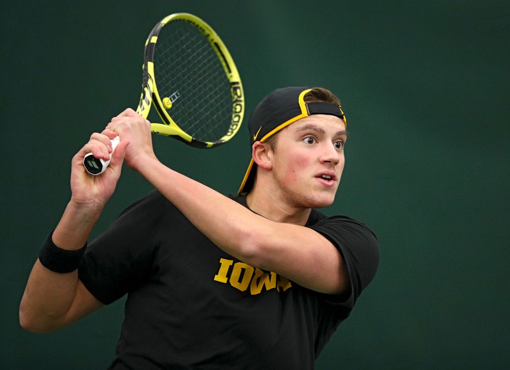 Iowa’s Joe Tyler returns a shot during their match at the Hawkeye Tennis and Recreation Complex in Iowa City on Thursday, January 16, 2020. (Stephen Mally/hawkeyesports.com)