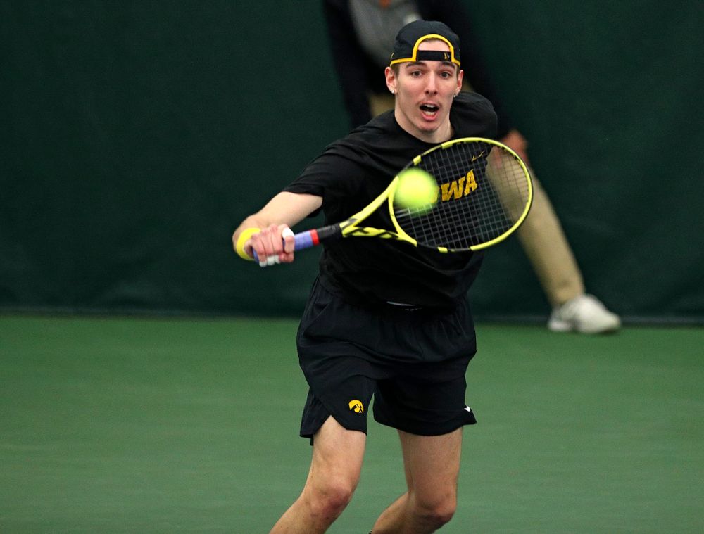 Iowa’s Nikita Snezhko returns a shot during his doubles match at the Hawkeye Tennis and Recreation Complex in Iowa City on Friday, March 6, 2020. (Stephen Mally/hawkeyesports.com)