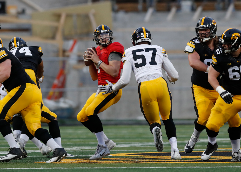 Iowa Hawkeyes quarterback Nathan Stanley (4)
and defensive end Chauncey Golston (57) during the final spring practice Friday, April 20, 2018 at Kinnick Stadium. (Brian Ray/hawkeyesports.com)