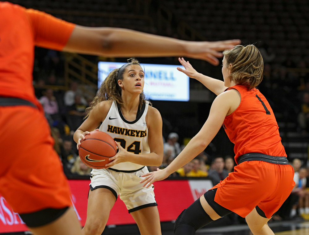 Iowa guard Gabbie Marshall (24) looks to pass during the first quarter of their overtime win against Princeton at Carver-Hawkeye Arena in Iowa City on Wednesday, Nov 20, 2019. (Stephen Mally/hawkeyesports.com)